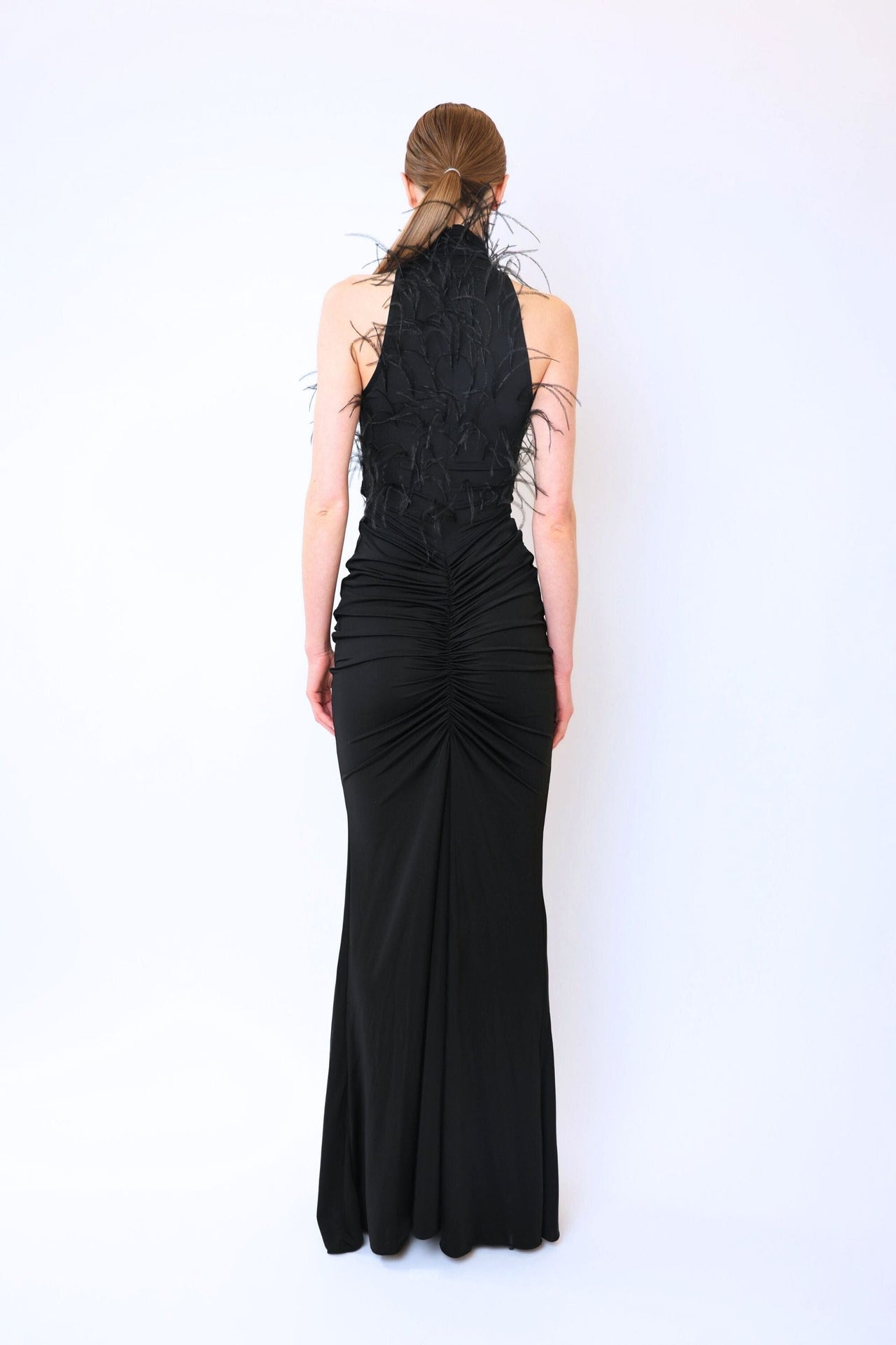 Jersey Sleeveless Halter Ruched Gown With Feathers